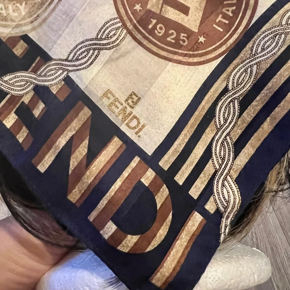 Fendi scarf 23 x 22.5” spend $400 get a free designer scarf valves at $400.
